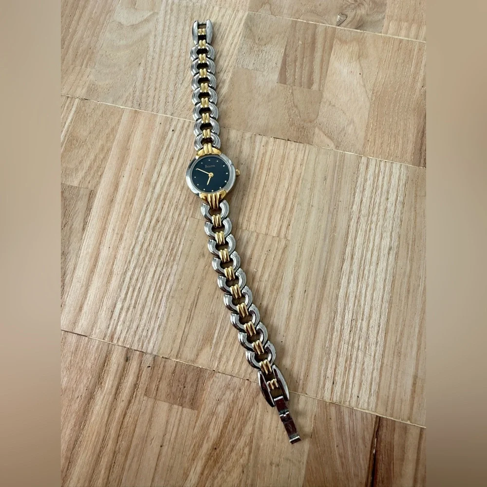 Bulova ladies black dial two toned dress watch NEW BATTERY